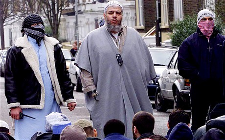 Abu Hamza speaks to his followers outside Finsbury Park Mosque. The preacher is named by US authorities as responsible for recruiting dozens of terrorists