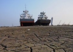 Chinese fishing boats are seen stranded a dried up river bank along the Yangtze river. Drought on the massive waterway has led to historically low water levels that have forced authorities to halt shipping, the government and media said Thursday.